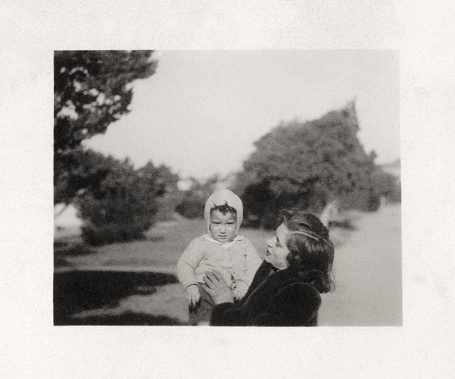 Mother and son in a public park. 1950.