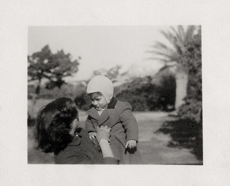 Mother and son in a public park. 1950.