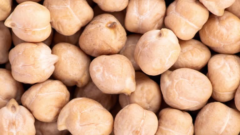 Video background of chickpeas background. Healthy vegan food concept. Top view banner with Chickpeas close up