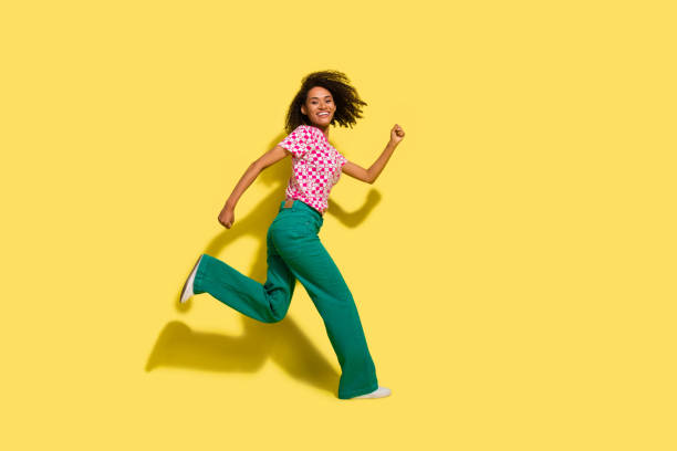 istock Full body profile photo of nice overjoyed active person running empty space isolated on yellow color background 2094313019