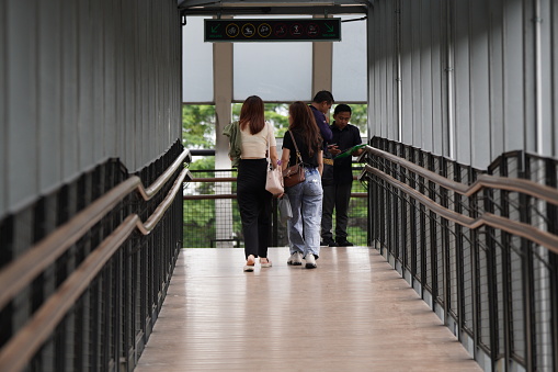 Pedestrians are crossing the Gelora Bung Karno pedestrian bridge in Jakarta, Indonesia, on March 3, 2024