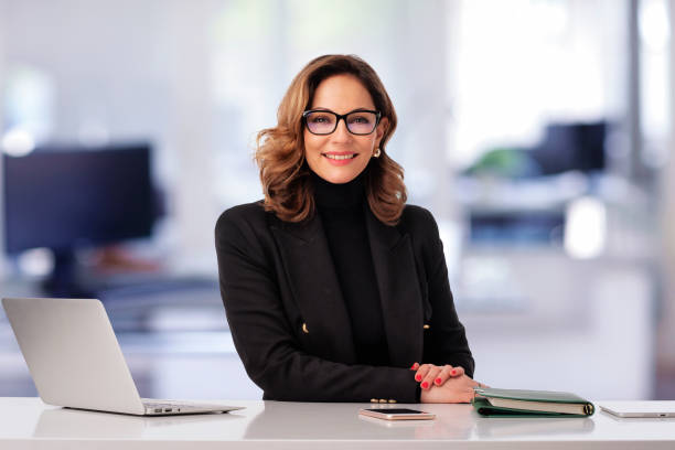 istock Blond haired businesswoman sitting at the office and using laptop for work 2094334403
