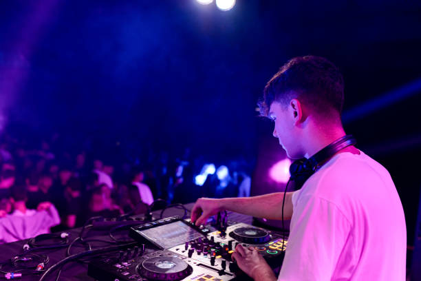 istock Rear side view of a dj working on a discotheque 2094334421