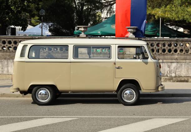 Percoto, Italy. March 17, 2024. Beige and white vintage Volkswagen Transporter, known as Type 2,  iconic panel van introduced in the Fifties. Side view.