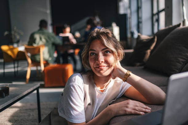 istock Young Woman in Co-Working Space Enjoying Productive Day 2094340945
