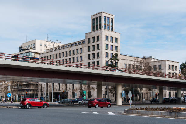 Madrid, Spain - February 11, 2024: Castallana Avenue, overpass and AESA building