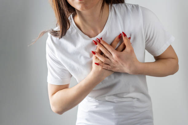 istock Young woman holds her aching heart 2094344700
