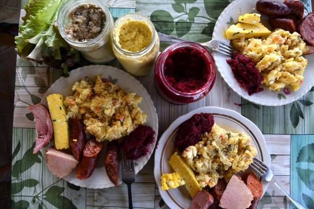 Easter table with salad, eggs, ham, sausage, beetroot and horseradish stock photo