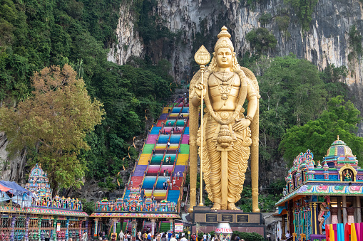 Kuala lumpur, Malaysia - 12 March, 2024. Batu Caves, a limestone cave that is more than 400 million years old, is a sacred place amidst mountains with colorful stairs and statues of Hindu gods.