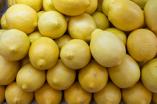 Fresh yellow lemons, beautiful and delicious, ready for distribution after sorting for quality.