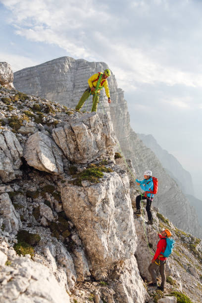 istock Group of mountain climbers on their way to the top 2094423697