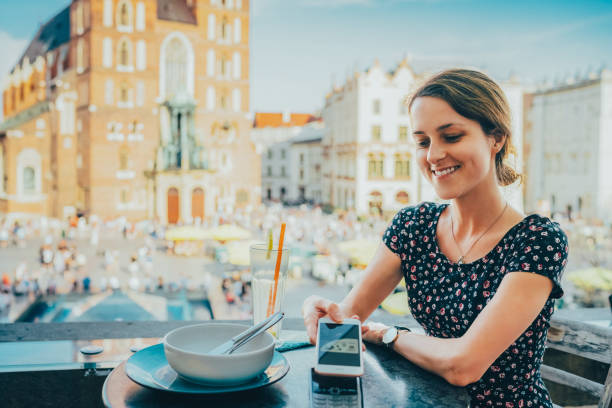 Tourist visiting Krakow is eating lunch in restaurant