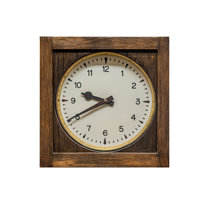 Old vintage wooden clock isolated on white background.