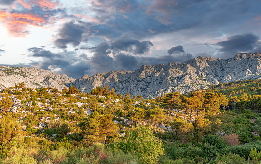 View of the rocky mountain and the contrasting cloudy sky. Croatia