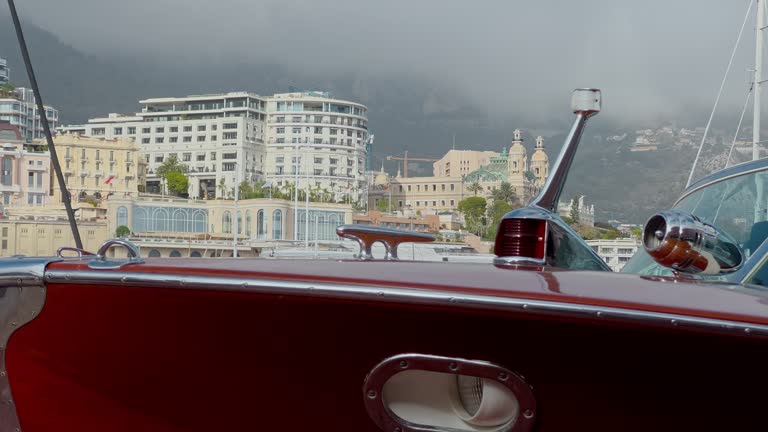 Monaco, Monte-Carlo, Bow of retro boat at the largest fair exhibition in the world yacht show, port Hercules, a lot of new mega yachts, rich clients, yacht brokers, cloudy weather