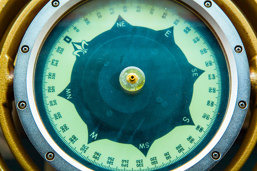 Classic gyrocompass on the bridge of a ship close-up.