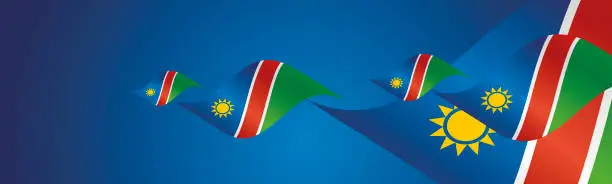 Vector illustration of Namibia Independence Day waving flags two fold blue landscape background