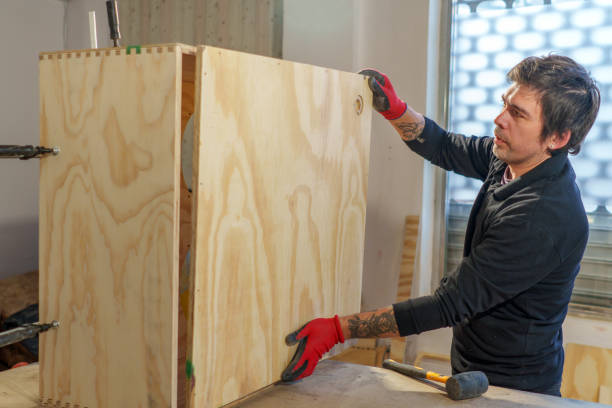 istock Hispanic male carpenter working standing in woodworking shop 2094509385
