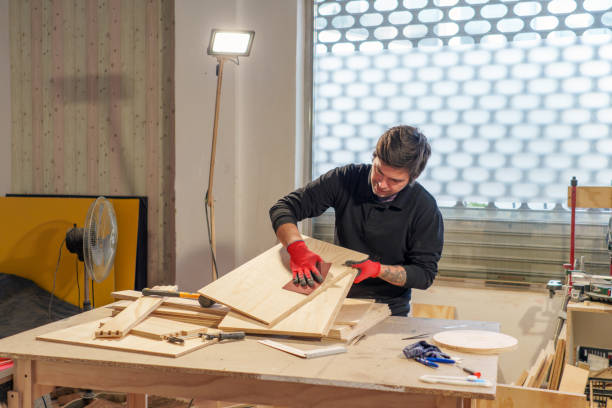 istock Hispanic male carpenter working standing in woodworking shop 2094510429