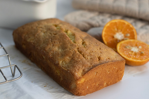 Loaf of Orange pound cake, also known as citrus loaf cake or orange butter cake. Moist, flavorful dessert, perfect for food lovers and baking enthusiasts, with zesty glaze perfect for sweet cravings
