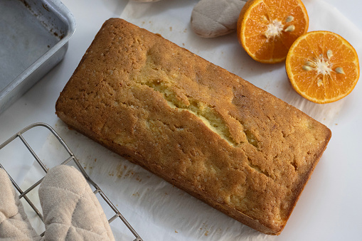 Loaf of Orange pound cake, also known as citrus loaf cake or orange butter cake. Moist, flavorful dessert, perfect for food lovers and baking enthusiasts, with zesty glaze perfect for sweet cravings