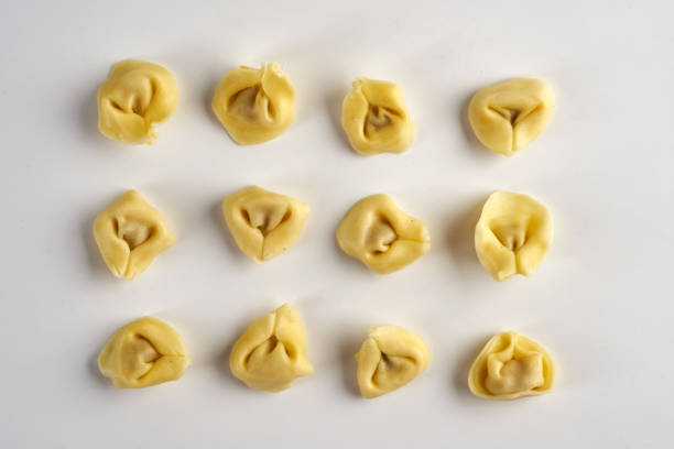 Tortellini stuffed Italian pasta isolated on white background