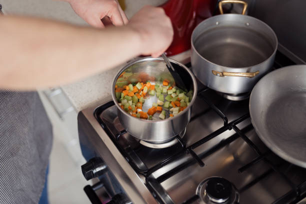 istock Preparing fresh vegetables for cooking on a gas stove 2094523734