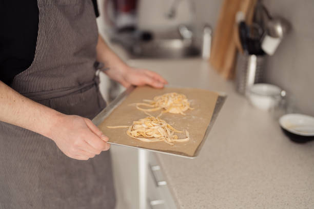 istock Chef preparing fresh homemade pasta in a modern kitchen 2094524289