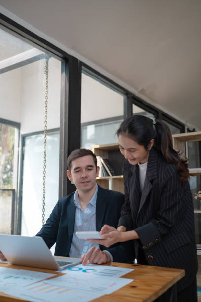 istock Mature executive helping new employee, Mentor, manager and teamwork with a business man training a female employee 2094526511