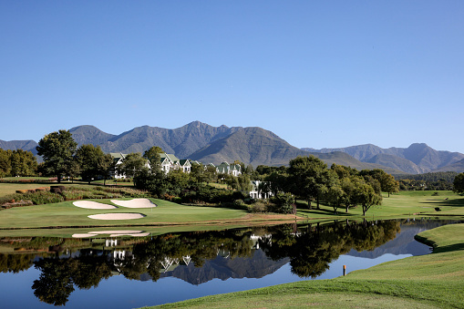Golf Course lakes and bunkers with mountains