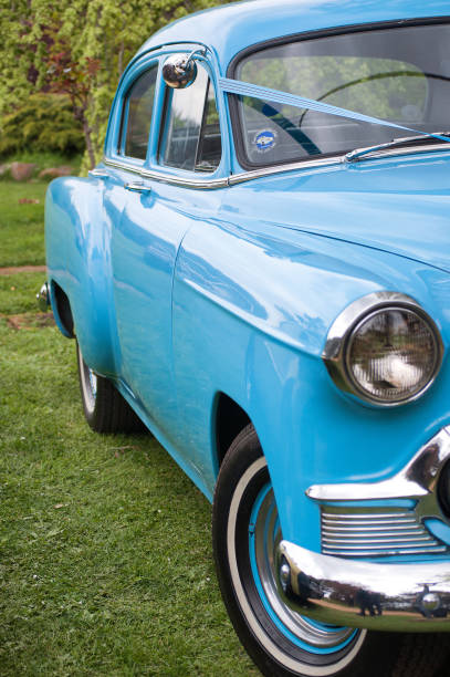 Brighton, Tasmania, Australia, October 6, 2012: View of a beautiful vintage blue Chevrolet motor vehicle in excellent condition, being used as a wedding car, parked on lawns outside a reception venue