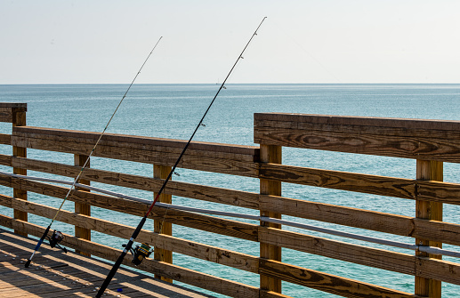 Fishing rods on the deck Dania beach Florida