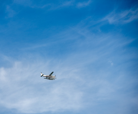 Small plane against blue skies