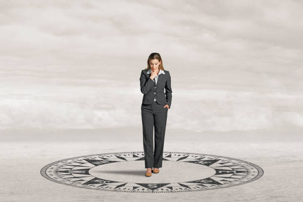 istock Woman Looks Down At Compass 2094584891