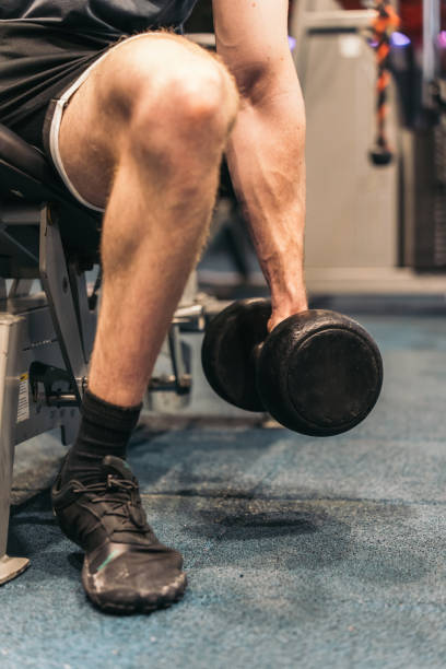 istock Close-up of Anonymous Athlete Holding Dumbbell for Bicep Curl. 2094585959