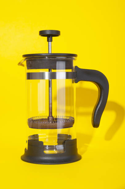 istock Empty french press close up  on yellow background 2094627293