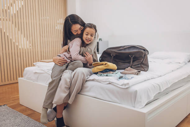 istock Woman and daughter hugging 2094638023