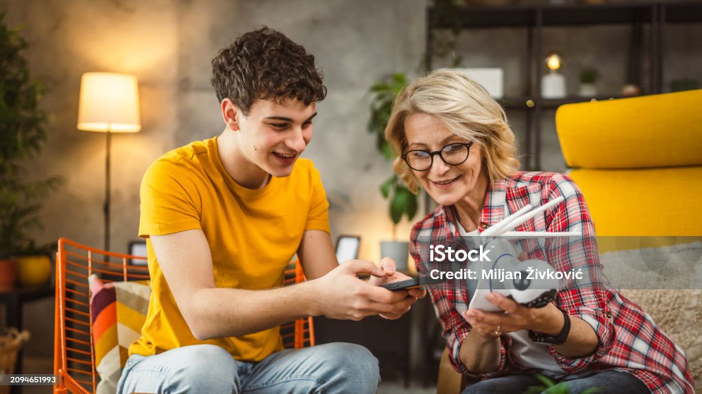 Mother And Son Adjust And Install Home Cctv Video Surveillance Camera