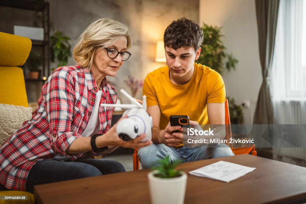 Mother And Son Adjust And Install Home Cctv Video Surveillance Camera