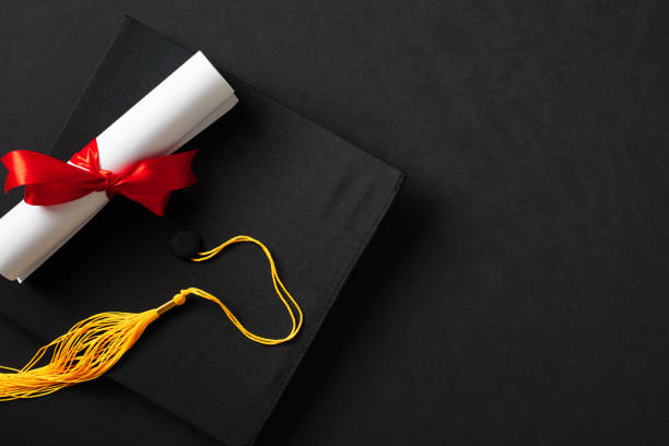 istock Flat lay composition with graduation hat and diploma on black background. Top view. 2094688714