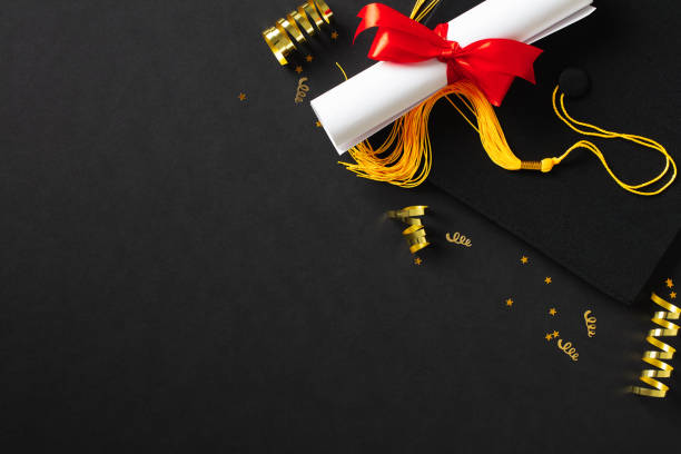 istock Flat lay composition with graduation hat and diploma on dark background 2094689791