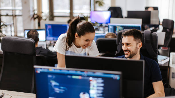 istock Female and male Caucasian developers working on a computer at the open space office 2094691383