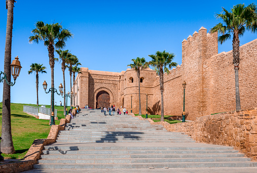 Rabat, Morocco - February 17 2024: The walls of the Kasbah of the Udayas and the monumental main Almohad gate of the Kasbah, Bab Oudaia (or Bab Lakbir)