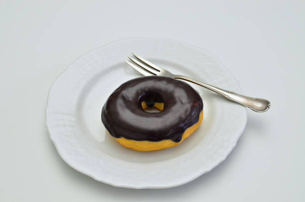 Chocolate Donut on white Plate stock photo