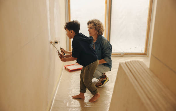 istock Mother and son engaged in DIY home renovation activity 2094733598