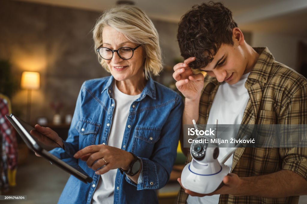 Mother And Son Adjust And Install Home Cctv Video Surveillance Camera(03)