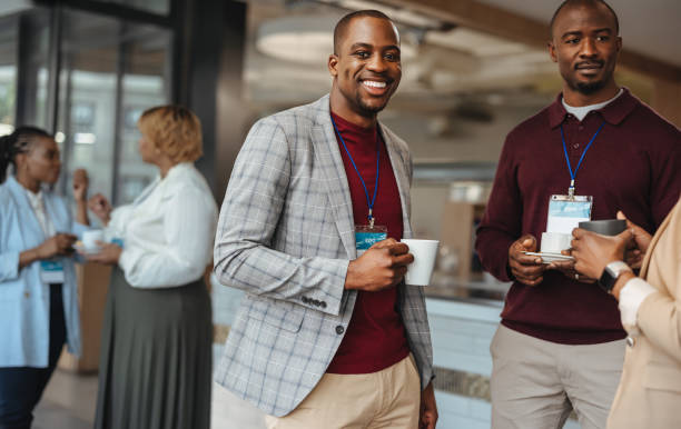 istock Happy businessmen engaging in casual conversation at a networking event 2094748682