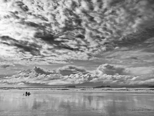 Cloudscape reflecting on a beach at Blyth in Northumberland