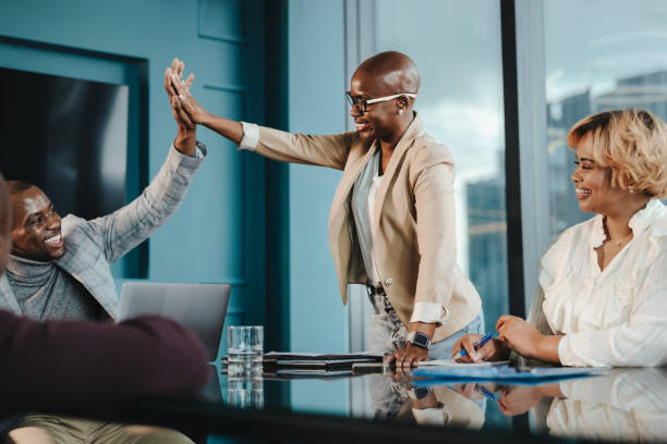 istock Successful business colleagues celebrating together in the office 2094751907