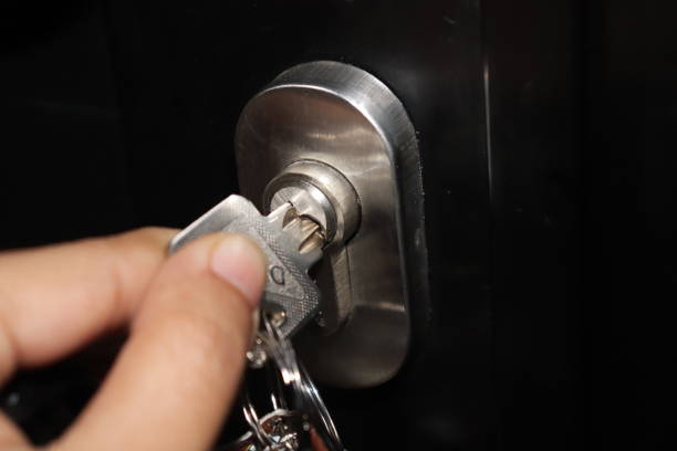 istock Someone locking the door with a key 2094754007